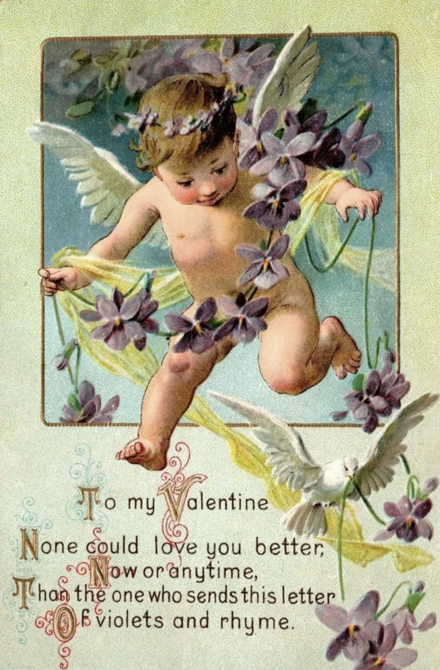 A Victorian valentine postcard: a cherub surrounded by violets, a white dove below — 'Of violets and rhyme'